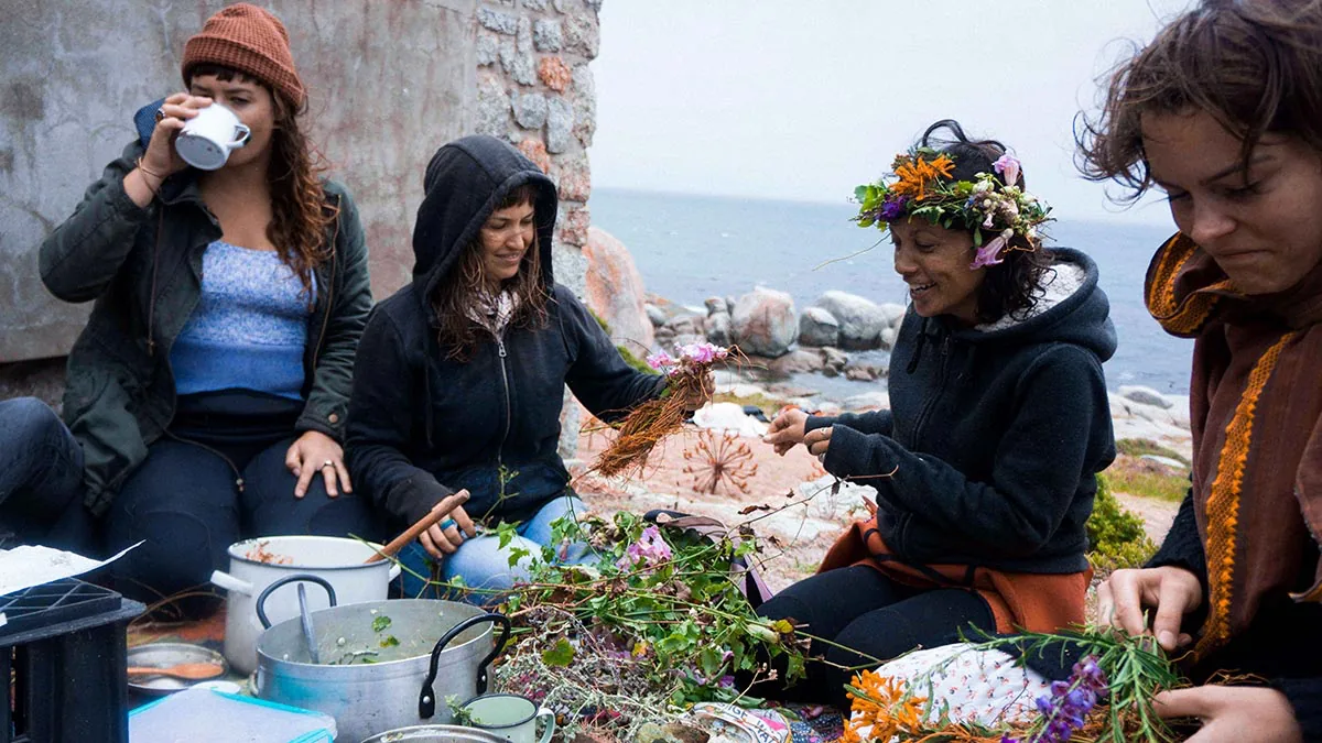 Roushanna and the women of Veld & Sea gathered on the rocks