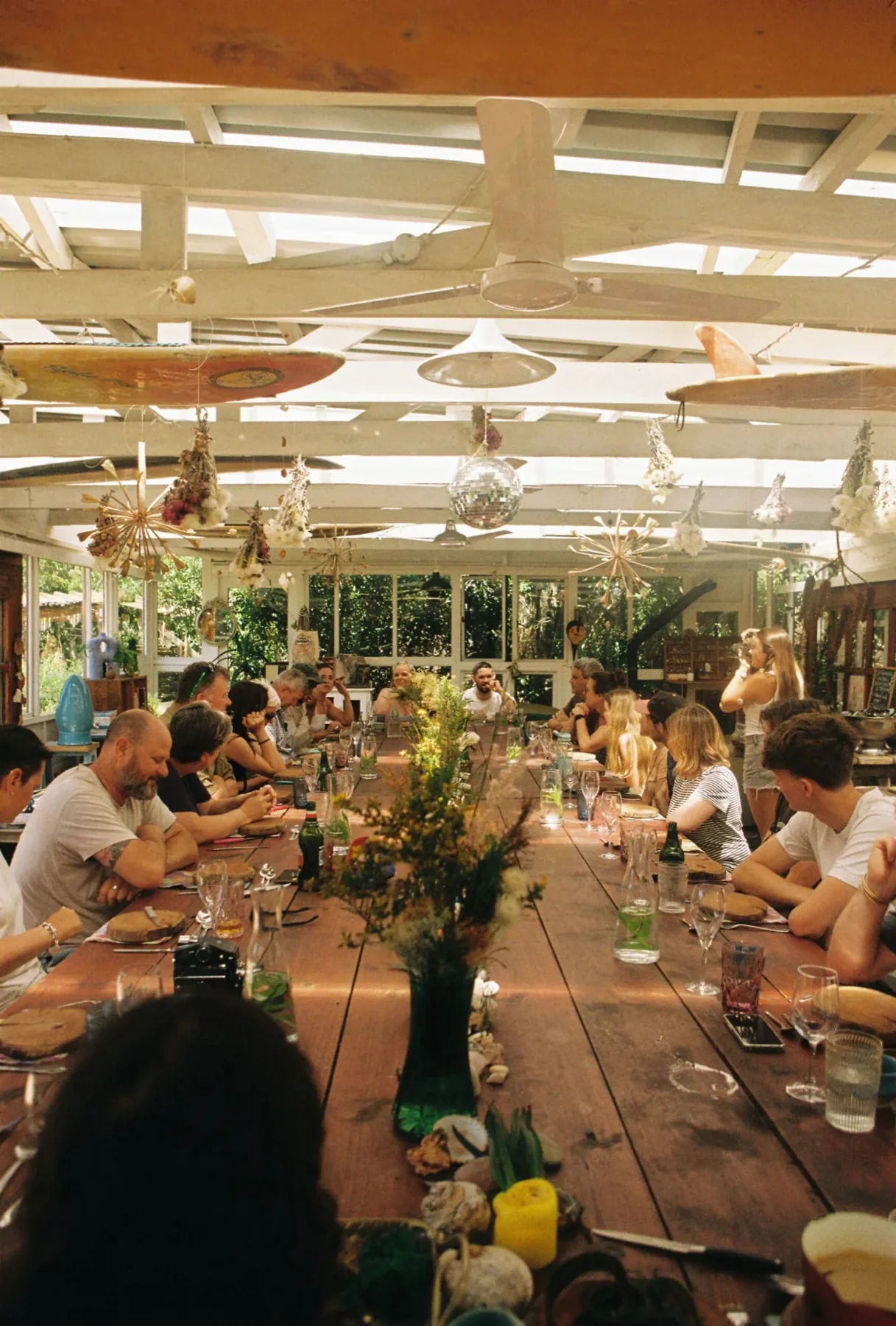 A long table gathering in the Veld & Sea glasshouse
