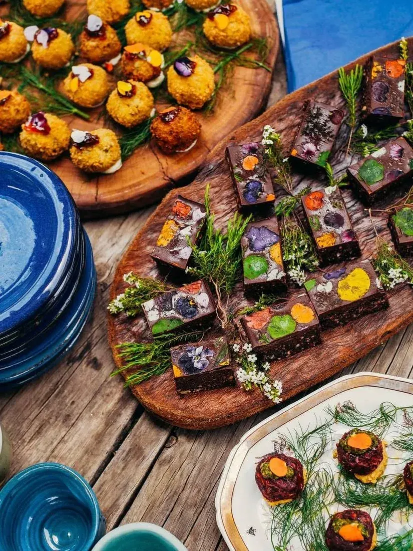 Wild foraged dishes plated with edible flowers